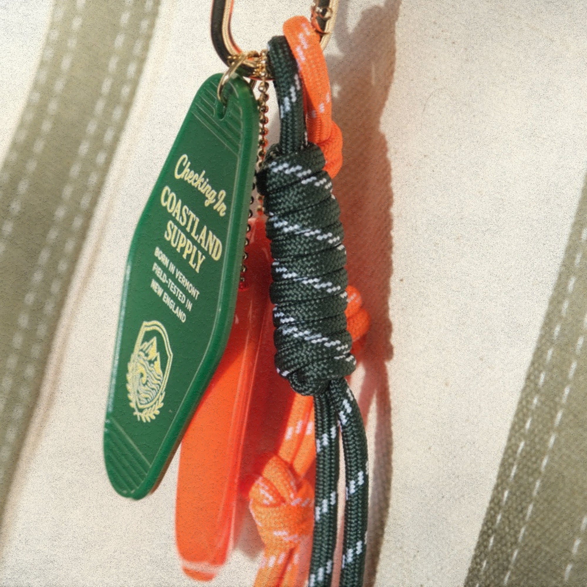 The Coastland Check-In Charm