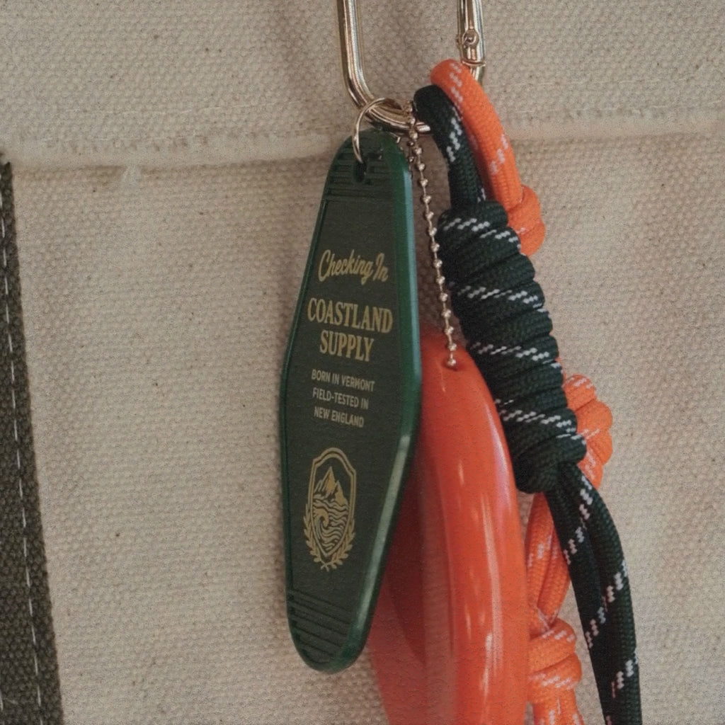 The Coastland Check-In Charm